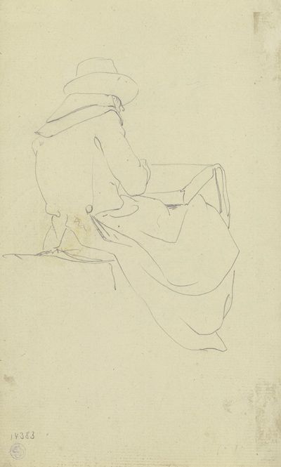 一个绘图员坐在后面，膝盖上放着速写本